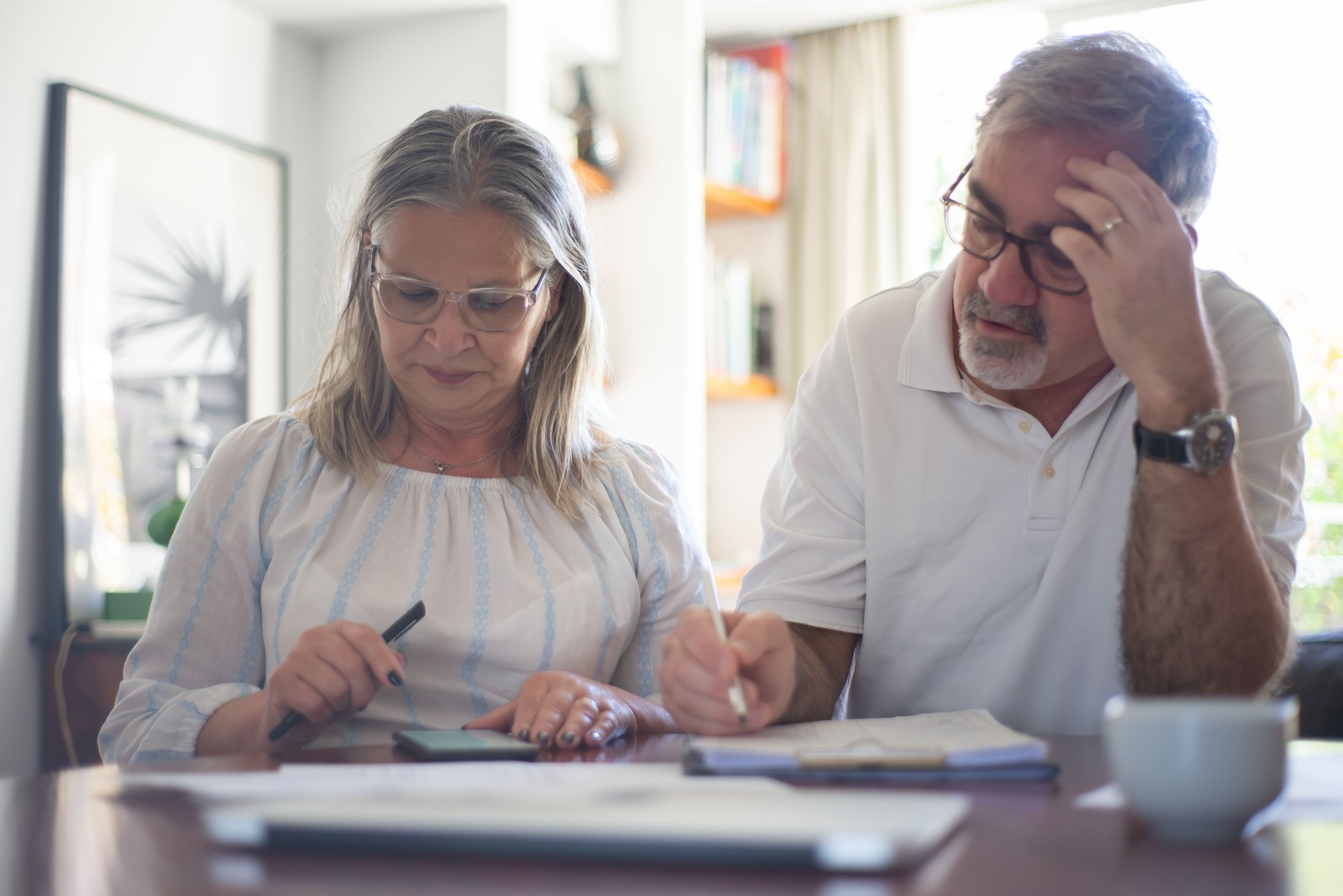 older couple reviewing documents older couple reviewing documents